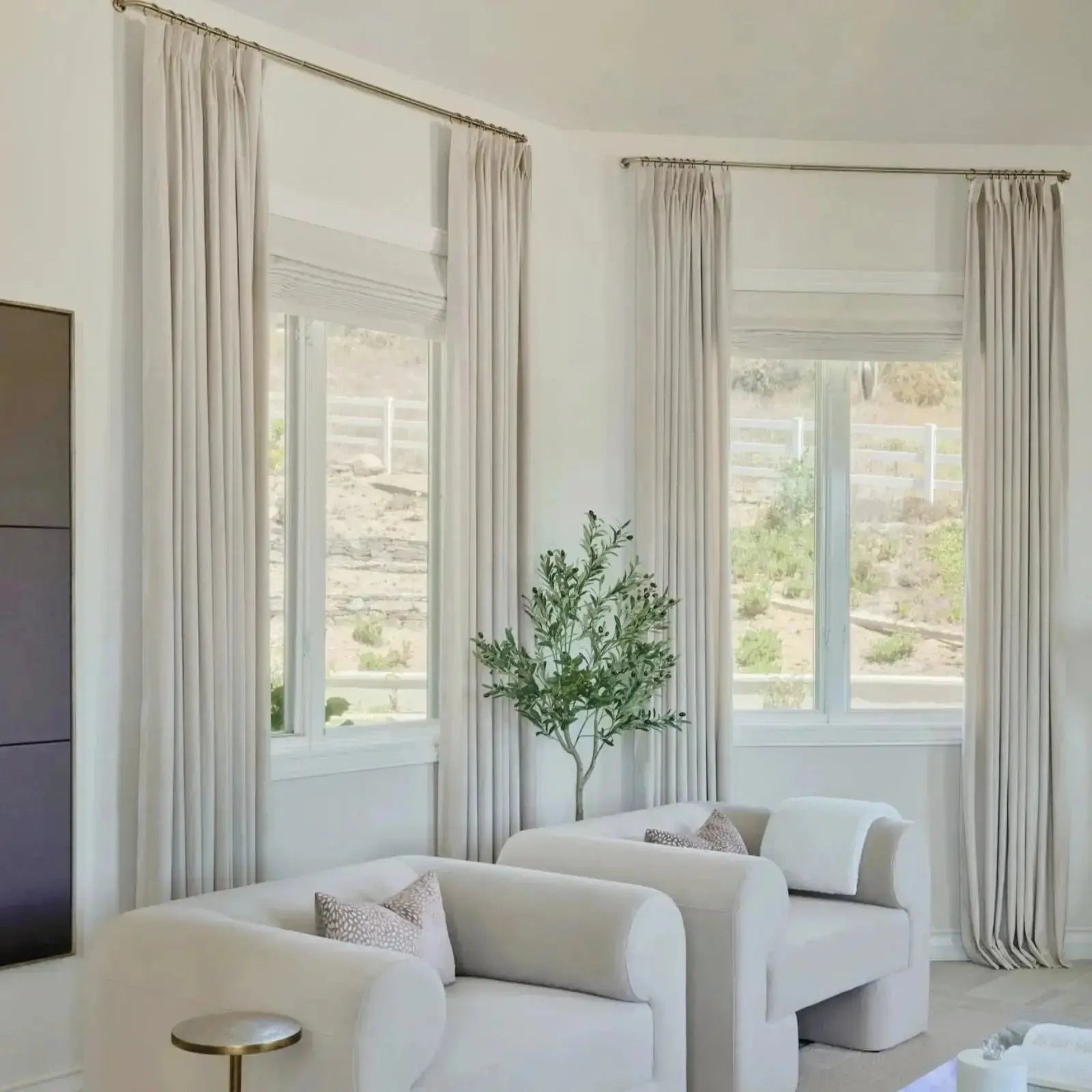 Birkin Velvet Pleated ivory drapes in a bright modern living room